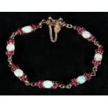 18k opal and ruby bracelet approx 8.2g CONDITION REPORT: No damages to bracelet.