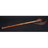 African axe with steel blade, the shaped handle with carved ringed decoration,
