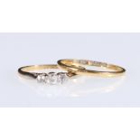 18ct gold three stone diamond ring, 1.6g gross and a wedding band, 1.