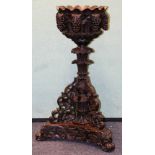 Late 19th century Anglo-Indian carved padouk jardiniere stand,