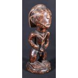 African carved wood standing male figure possibly Congolese with stylised hair and scarified face