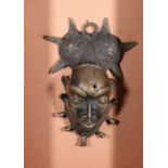 Benin bronze plaque of a warriors head with elaborate coiffure, the bronze, 24cm x 17cm ,