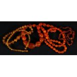 Three strands of amber or amber effect beads