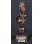 African male standing figure possibly Baule Ivory Coast with lag plaited beard,