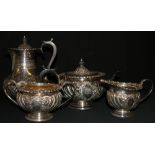 Victorian silver four piece tea service with gadroon and scroll decoration,