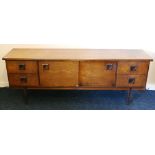 1960's Danish Mogens Kold teak sideboard with sliding central door and four drawers,