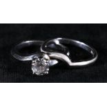 14ct white gold diamond solitaire cross-over ring, the diamond between 5mm and 6mm or 0.5ct or 0.