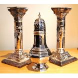 Silver octagonal sugar caster and a pair of classical Corinthian column candlesticks with swag