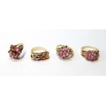 Coloured gold knot ring and three others with pink topaz, all 9ct.