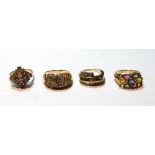 Four multi-gem rings in 9ct gold.