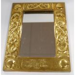 Scottish Arts & Crafts brass mirror, the frame with knotwork and serpents,