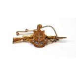 Gold Royal Sussex Regiment sweetheart brooch, modelled as a rifle, '9ct', c. 1915.