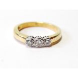 Diamond three-stone ring in 18ct gold. Condition Report Size M, 4.