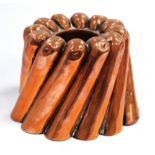 Victorian copper jelly mould of spiral circular form, unmarked, 10cm high.