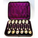 Set of twelve silver gilt coffee spoons with apostle terminals and angel knops, by Hyam Hyams 1878,