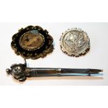 Scottish silver pebble brooch, modelled as a claymore in grey chalcedony, a circular brooch, 1886,