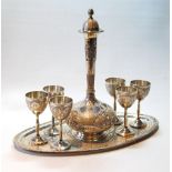 Set of six Iranian Isfahan silver liqueur goblets with typical chased decoration, and the decanter,