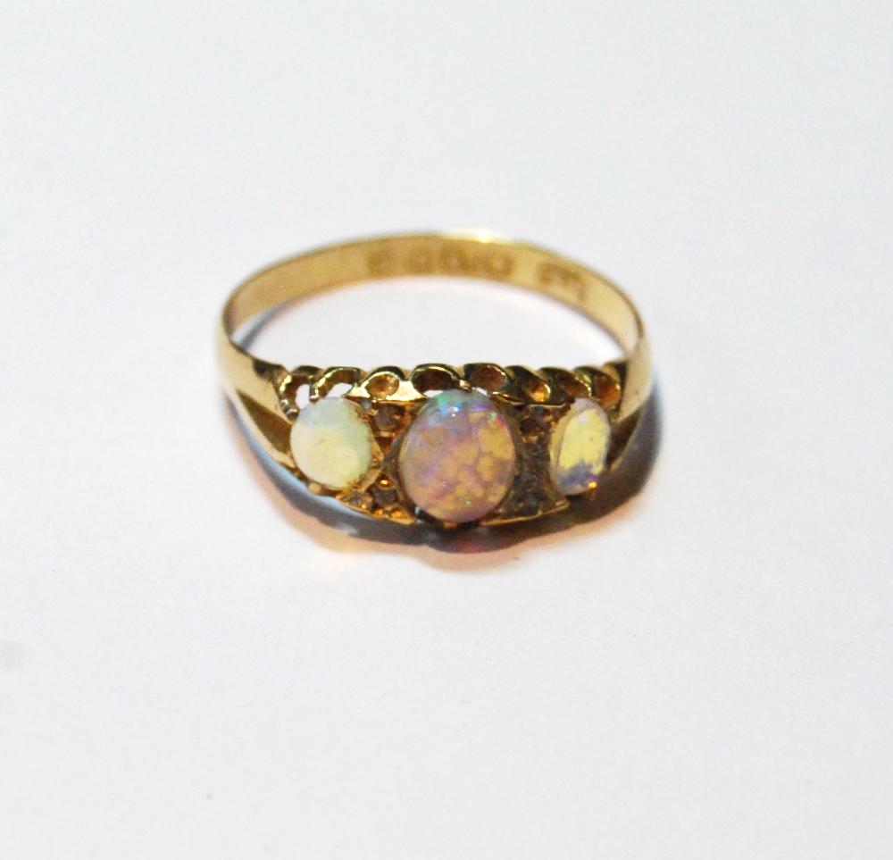 Opal three-stone ring with diamond points in 18ct gold, 1902.
