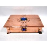 Arts and Crafts copper and enamel casket with blue and green enamel roundels and riveted strapwork,