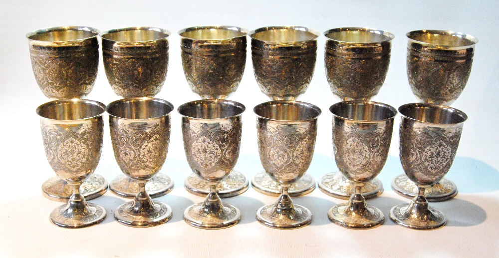 Set of six Iranian Isfahan silver wine goblets and six others, smaller, with waisted stems,