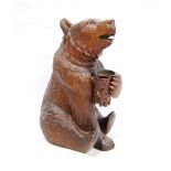 Black Forest carved walnut bear, 30cm.