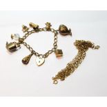 Two 9ct gold necklets and a similar bracelet with some gold charms.