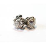 Pair of diamond ear studs, each with an old-cut brilliant, approximately 1.