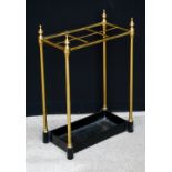 Victorian tubular brass six-division stick stand with knopped finials, 61cm high.