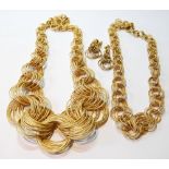 Two 9ct gold necklaces of many entwined links and a pair of similar earrings.