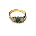 Diamond and emerald three-stone ring, in 18ct gold.