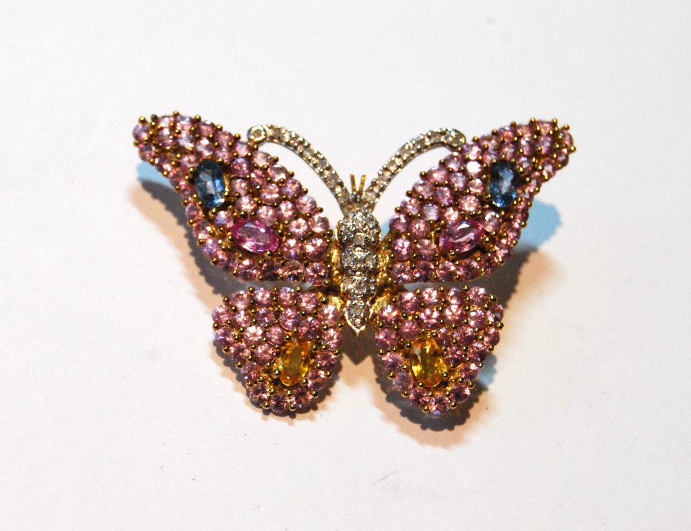 Gold butterfly brooch with various coloured sapphires and other gems, '9K'.