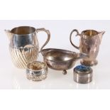 George III silver boat, indistinct marks, 11cm, two silver cream jugs, largest 9cm,