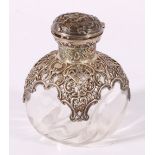 Victorian silver mounted scent bottle, the glass reservoir of pinched globular form,