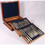 Victorian set of twelve mother-of-pearl handled silver plated fruit knives and forks in a mahogany