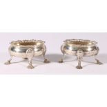 Pair of George III silver salts, with serpentine cast feet, marked indistinctly, 202g gross, 4.5cm.