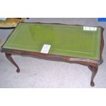 Reproduction mahogany rectangular coffee table with inset green top on cabriole supports.