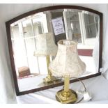 Framed wall mirror, carved wooden box and a modern table lamp.