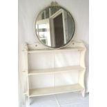 Set of painted white open bookshelves together with a circular painted wall mirror.