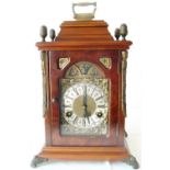 Reproduction walnut and mahogany bracket clock with silver and brass dial, silvered chapter ring,
