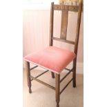 Oak bedroom chair upholstered in pink velvet.