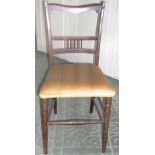 Mahogany framed bedroom chair upholstered in gold velvet.