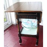 Oak reproduction style drop-leaf tea trolley.