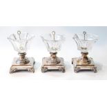 Set of three French cut glass salts on Sheffield plate bases.