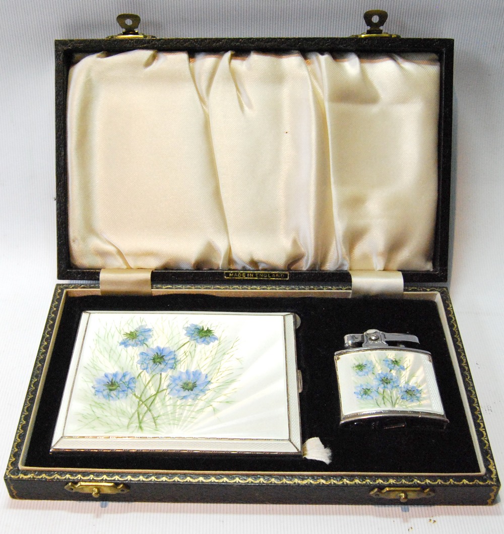 Silver cigarette case with enamelled spray of cornflowers, and the matching lighter, cased.