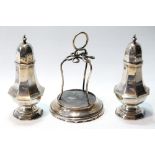 Pair of silver pepperettes, Birmingham 1895, and a hat pin stand, 1904.