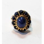 Ring with blue synthetic star sapphire surrounded by lapis lazuli, in gold, probably 14ct.