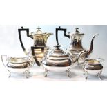 Silver five-piece tea and coffee set of boat shape with waved edges, on pad feet, Walker & Hall,