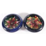 Two Moorcroft blue ground floral dishes.