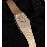 Ladies Rolex 14ct gold wristwatch with textured gold baton numeral dial,