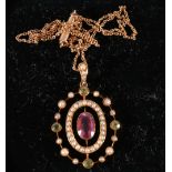 Edwardian 15ct amethyst peridot and seed pearl pendant necklace, on a small belcher chain,